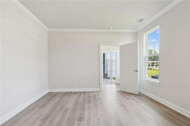 unfurnished room with light wood-type flooring and ornamental molding