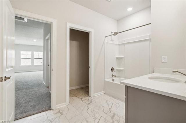 bathroom featuring shower / tub combination and vanity