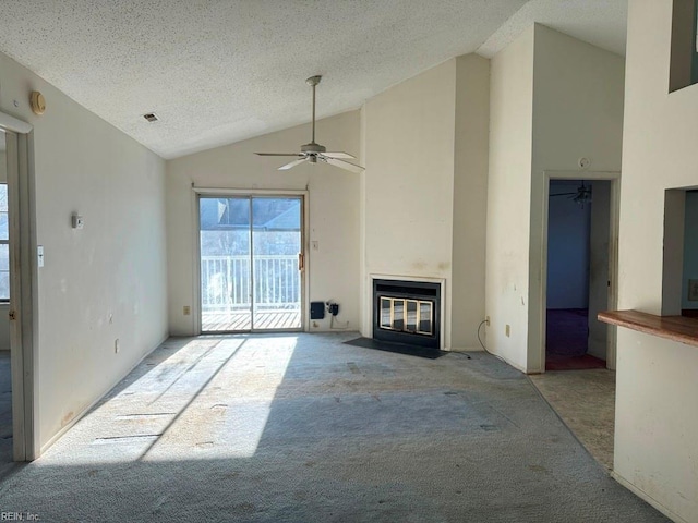 unfurnished living room featuring high vaulted ceiling, ceiling fan, a textured ceiling, and light carpet