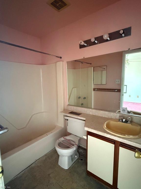 full bathroom with vanity, shower / bathtub combination, and toilet