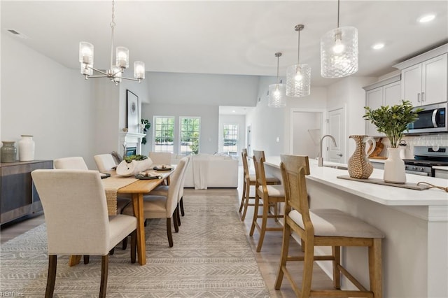 1232 Treviso Bay, Williamsburg, VA 23188 - dining room featuring recessed lighting, visible vents, a notable chandelier, and light wood-style floors