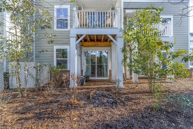 entrance to property with a balcony