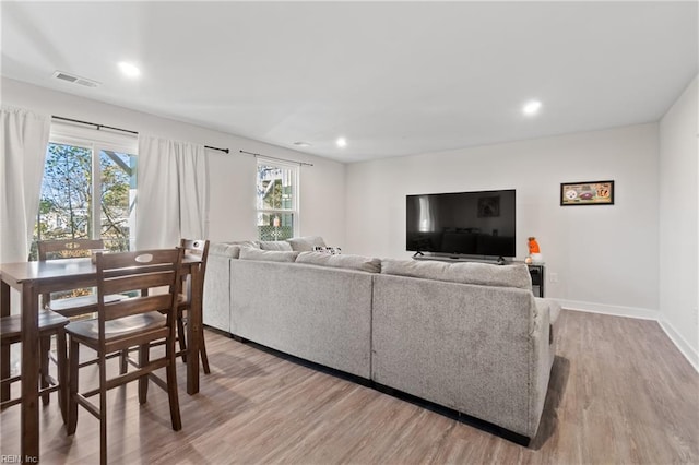 living room with light hardwood / wood-style flooring