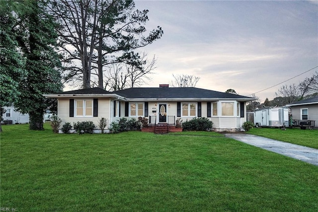 ranch-style house with a yard