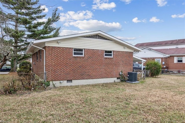 view of property exterior featuring a lawn and cooling unit