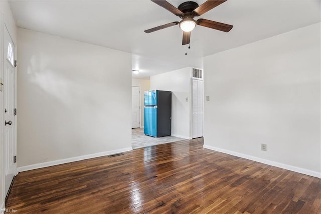 empty room featuring hardwood / wood-style floors and ceiling fan