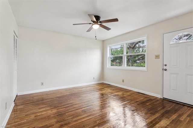 entryway with ceiling fan and dark hardwood / wood-style flooring