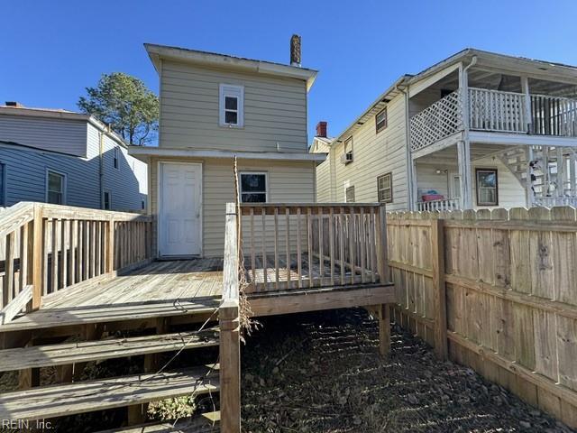 back of house featuring a deck