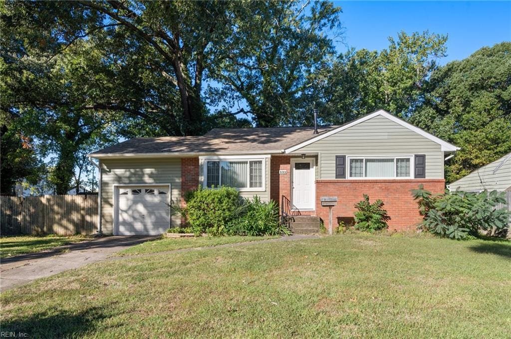 single story home with a front lawn and a garage