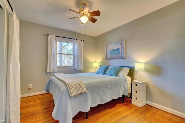 bedroom featuring ceiling fan and light hardwood / wood-style floors