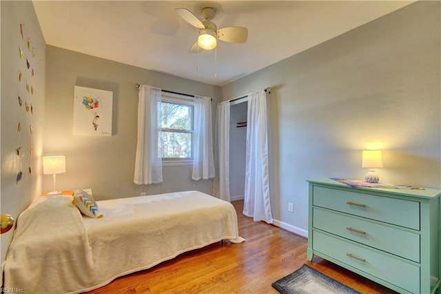 bedroom featuring ceiling fan and light hardwood / wood-style flooring