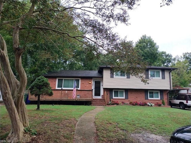 tri-level home with a front lawn