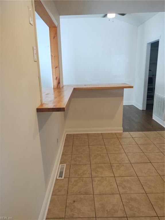 corridor with tile patterned flooring