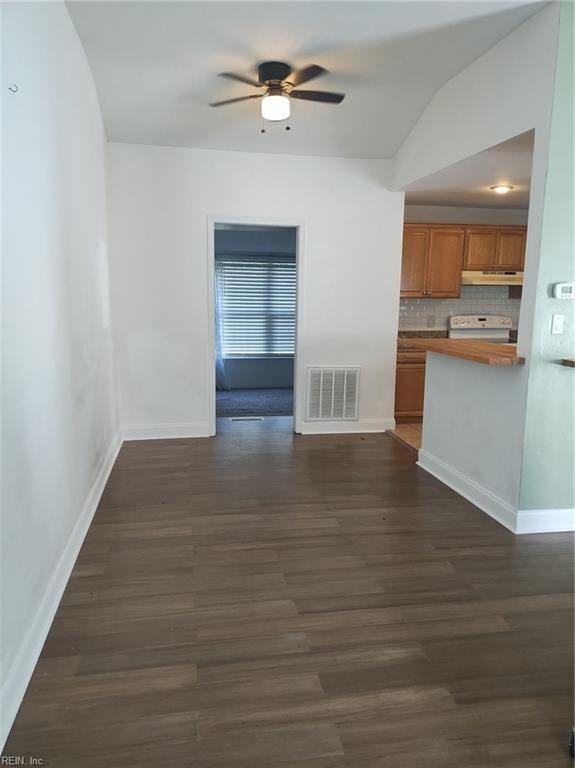 interior space featuring ceiling fan and dark wood-type flooring