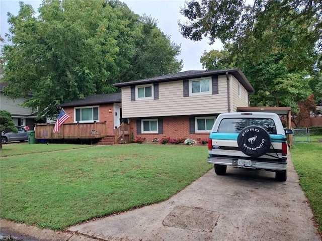 view of front of home with a front lawn and a wooden deck