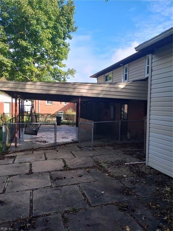 view of vehicle parking with a carport