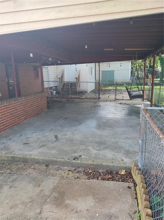 exterior space with a carport