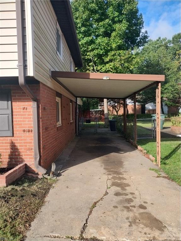 view of side of property featuring a carport