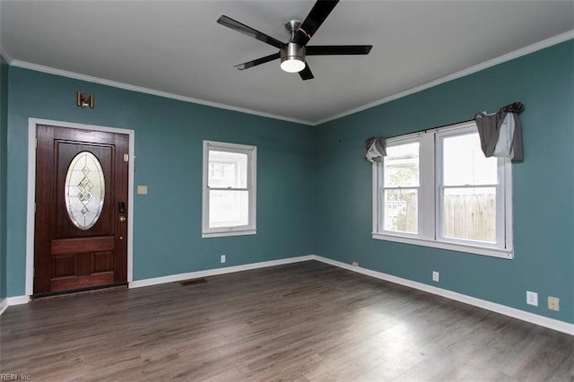 foyer featuring dark wood-type flooring, ceiling fan, and crown molding