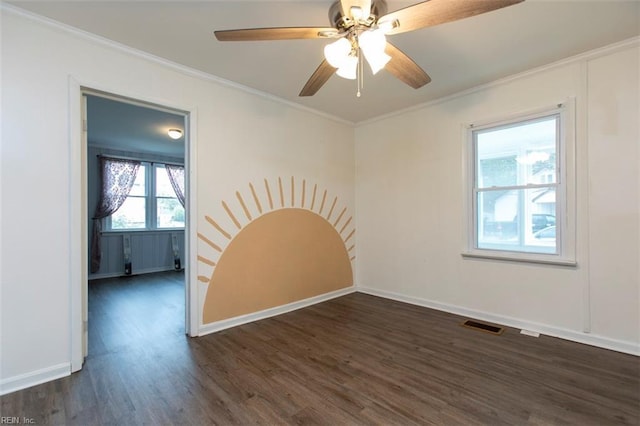 unfurnished room with dark wood-type flooring, ceiling fan, and crown molding