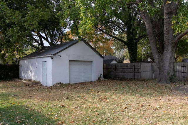 garage featuring a lawn