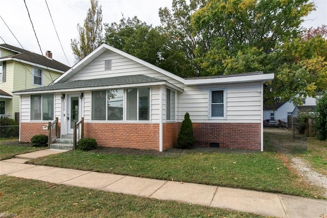 bungalow with a front yard