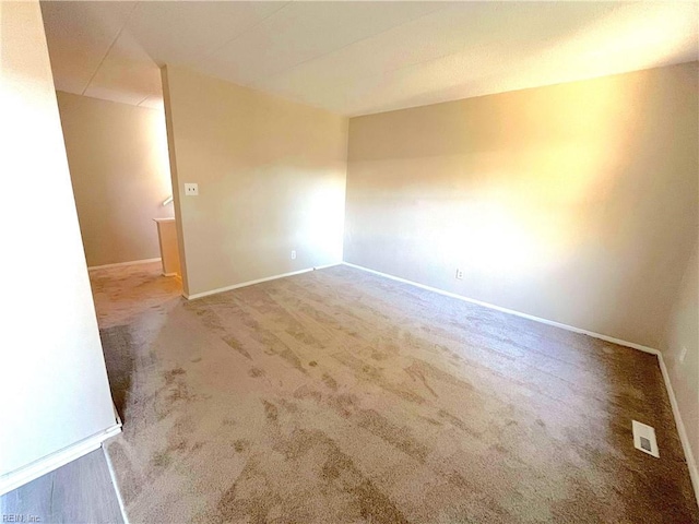 unfurnished room with carpet floors