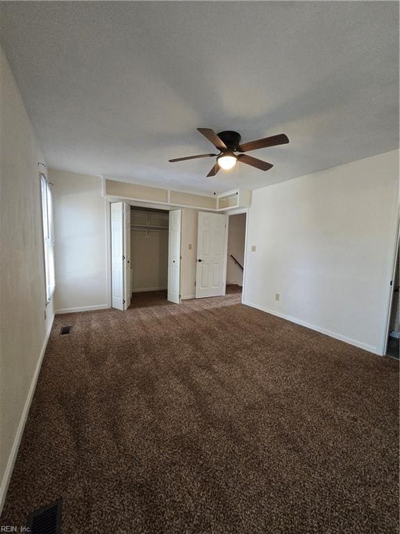 unfurnished bedroom with carpet flooring and ceiling fan