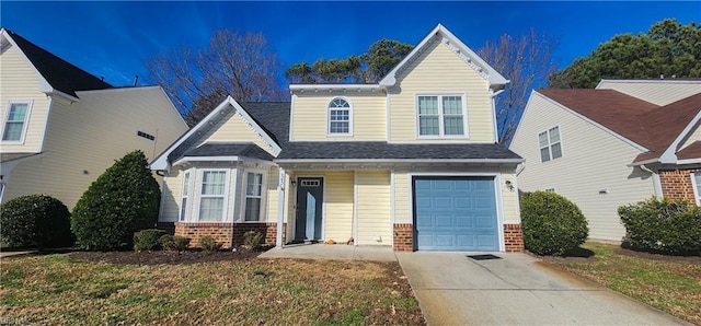 view of front of home featuring a front yard and a garage