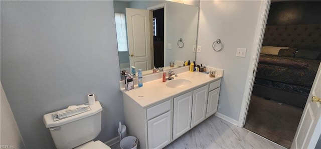 bathroom with vanity and toilet