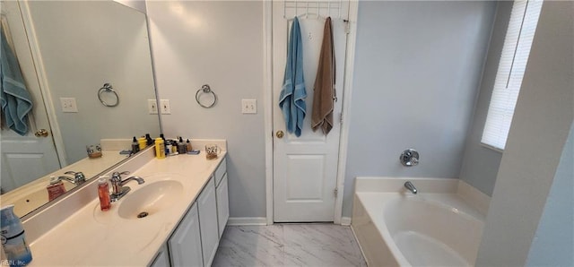 bathroom with vanity and a bathing tub