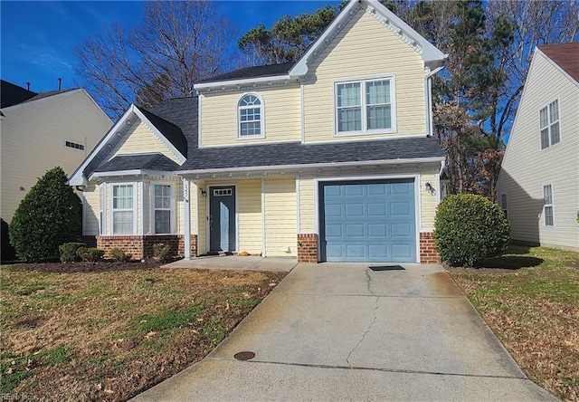 view of front of home with a garage and a front lawn