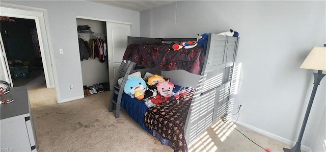 bedroom with light carpet and a closet