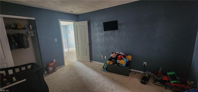 bedroom featuring light carpet