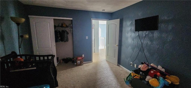 carpeted bedroom with a closet