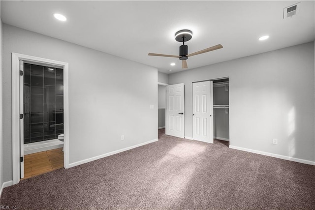 unfurnished bedroom with carpet, ceiling fan, and ensuite bathroom