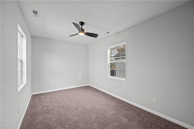 spare room with carpet flooring and ceiling fan