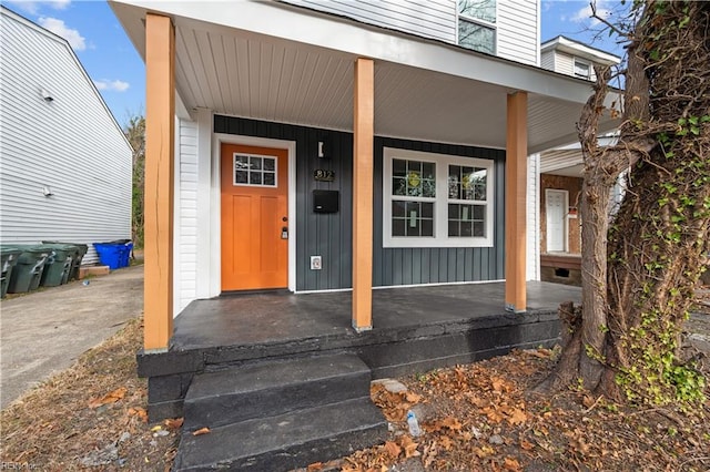 property entrance with covered porch