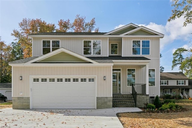 view of front of home with a porch and a garage