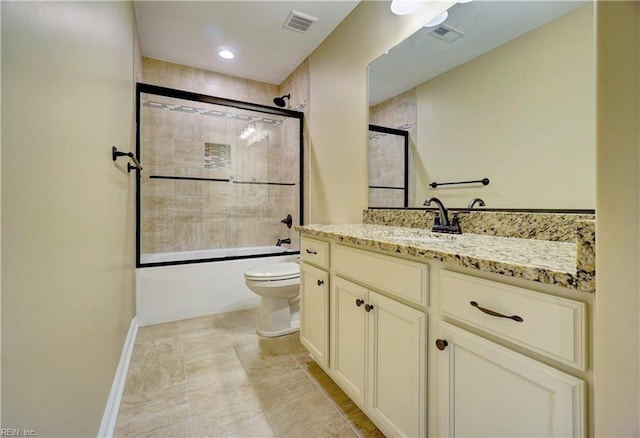 full bathroom with vanity, toilet, and bath / shower combo with glass door