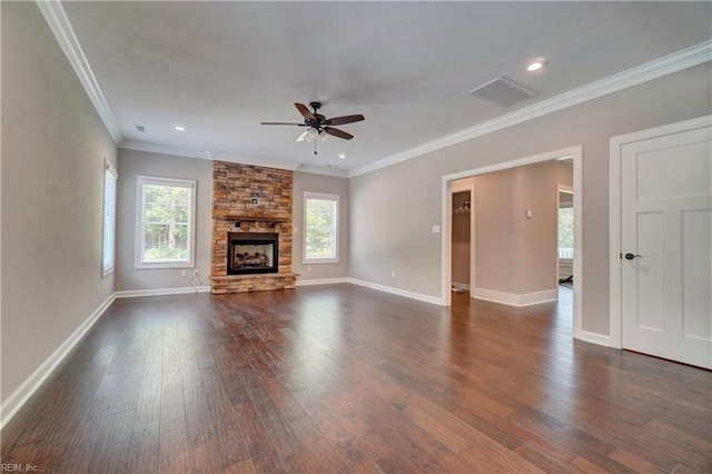 unfurnished living room featuring ceiling fan, ornamental molding, a fireplace, and dark wood-type flooring