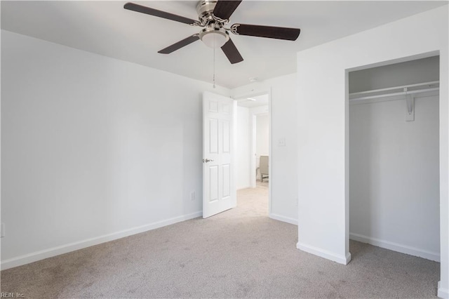 unfurnished bedroom with ceiling fan, a closet, and light carpet