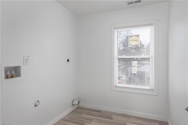 laundry room with hookup for an electric dryer, washer hookup, and light hardwood / wood-style flooring