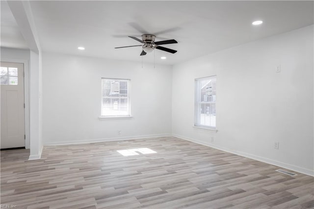 spare room with ceiling fan and light hardwood / wood-style floors