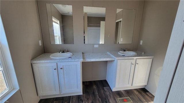 bathroom featuring hardwood / wood-style floors and vanity