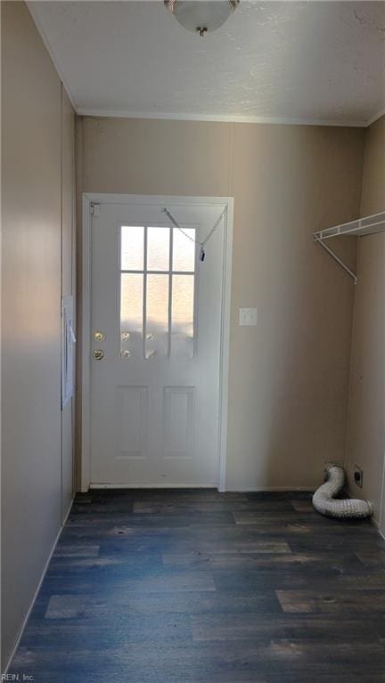 entryway featuring dark hardwood / wood-style flooring and ornamental molding