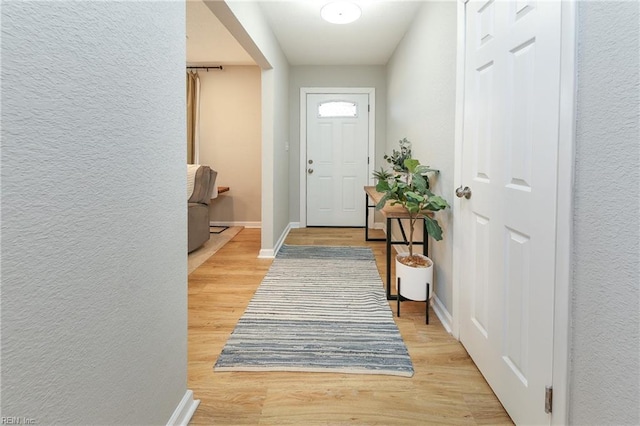 doorway to outside with light hardwood / wood-style floors