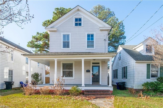 view of front of house with a front lawn and a porch