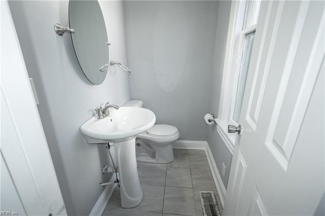 bathroom featuring tile patterned floors and toilet