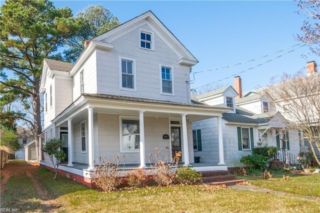 view of front of house featuring a porch and a front lawn